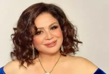 صورة إلهام شاهين بفستان أبيض من الدانتيل ومصمم أزياء يعلق على إطلالتها